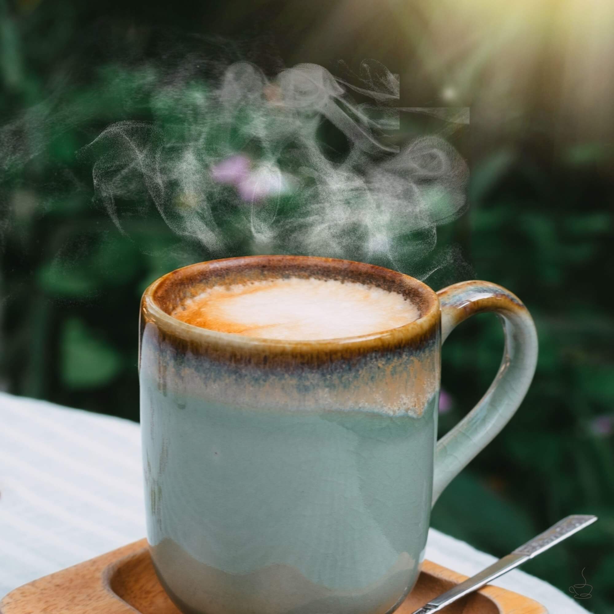 Homemade latte in a ceramic mug on a kitchen counter