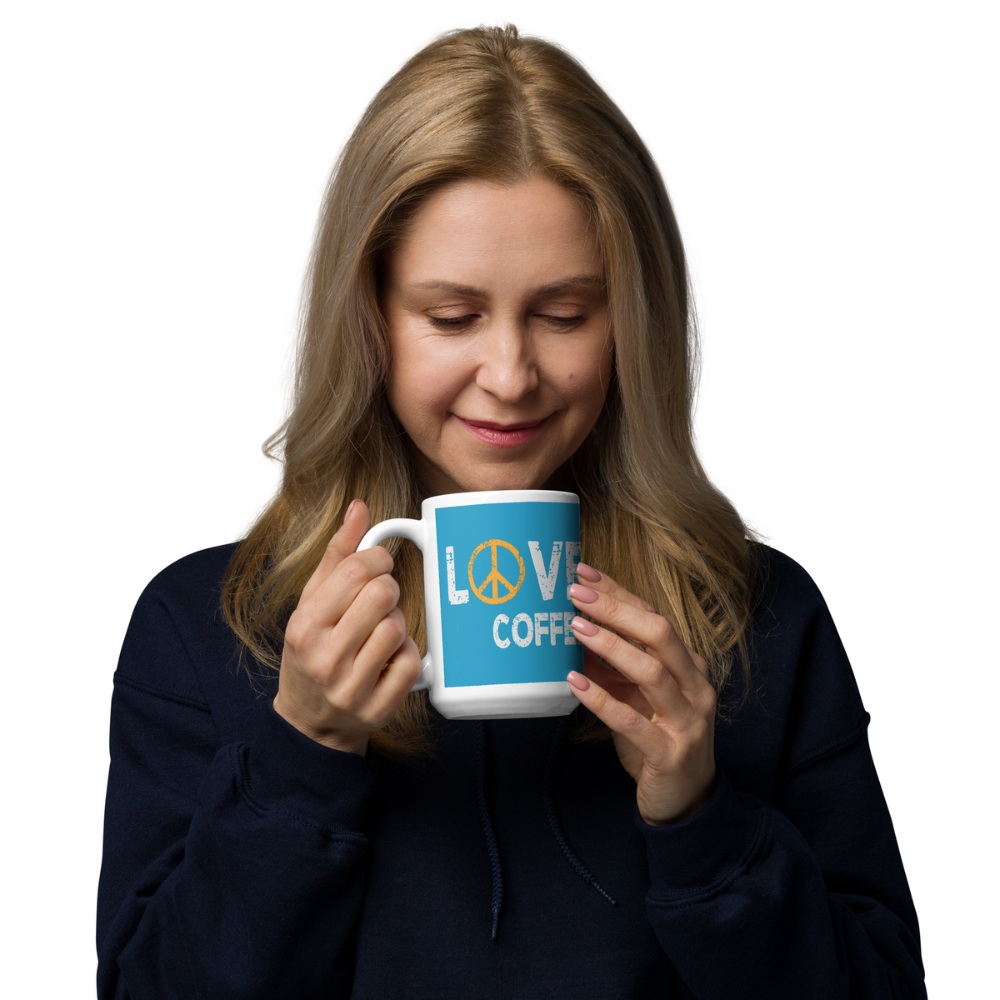 Peace Love Coffee, blue ceramic coffee mug female model drinking coffee