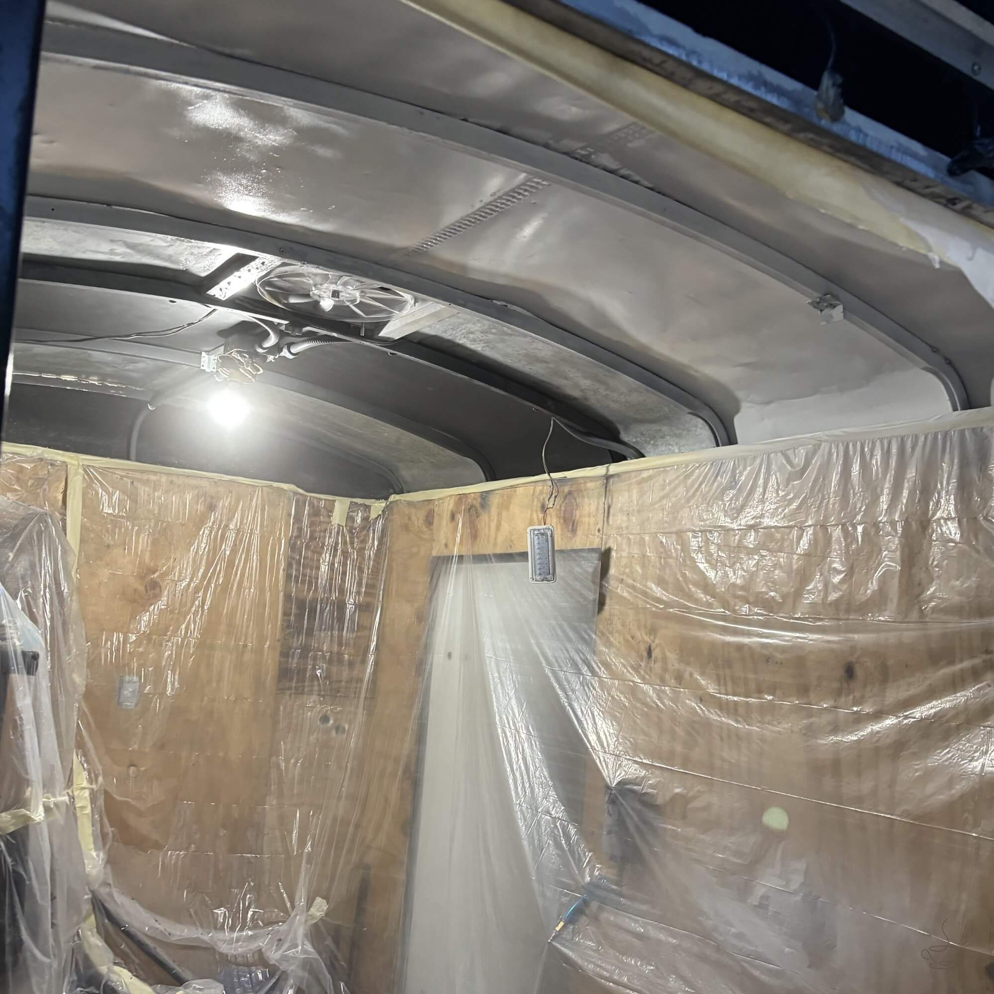 Coffee trailer layout plans, tape marks on the floor and tools