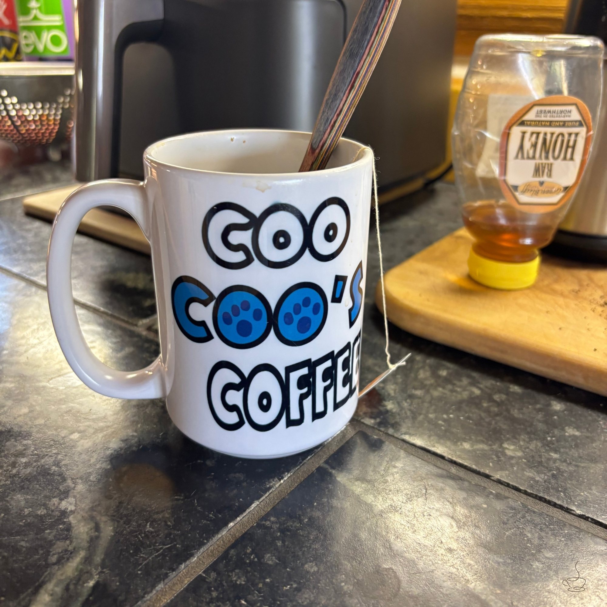 Customer photo featuring a Coo Coo’s Coffee mug design