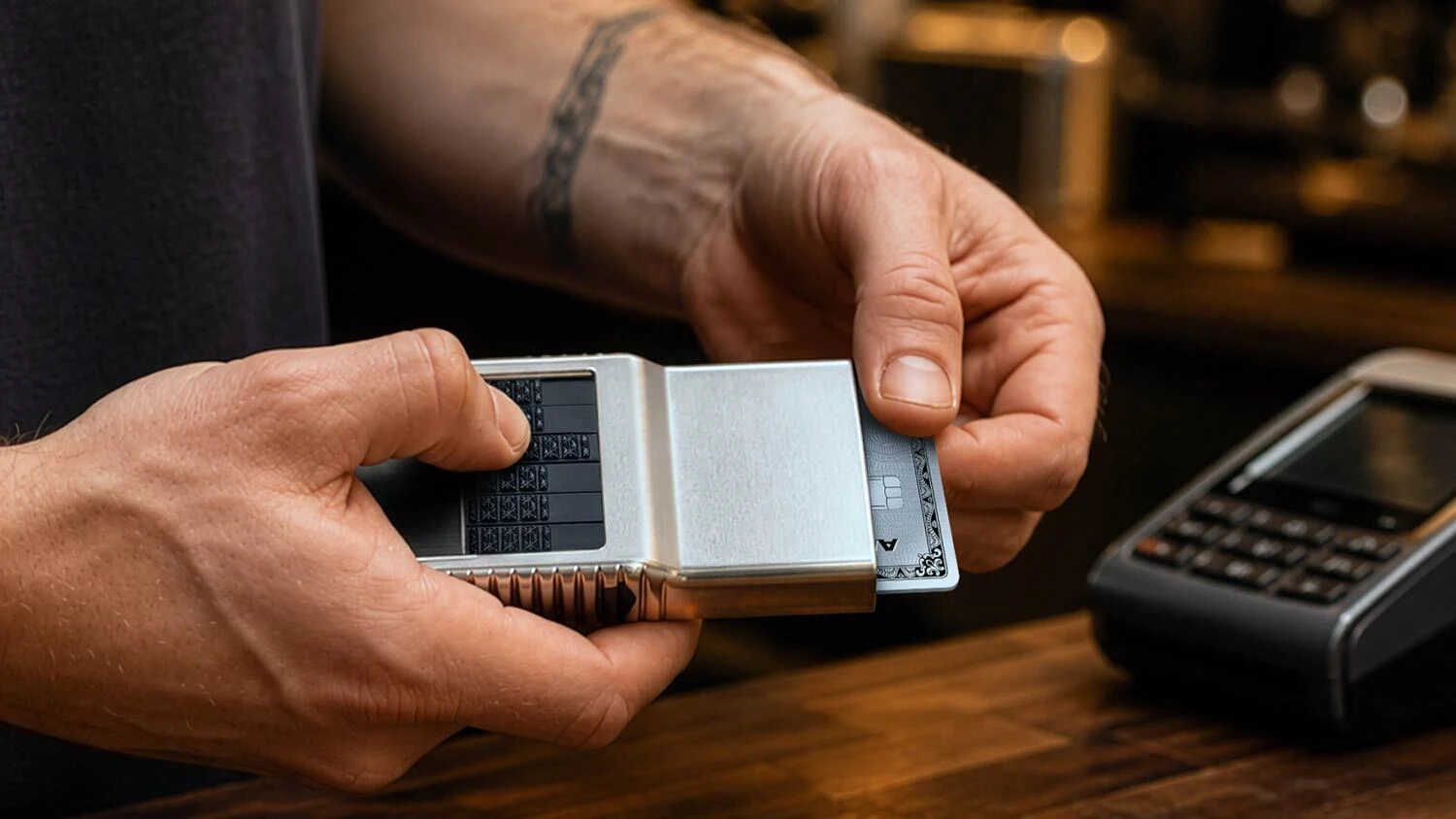 Selecting an individual card from an ACM aluminum wallet at the coffee counter