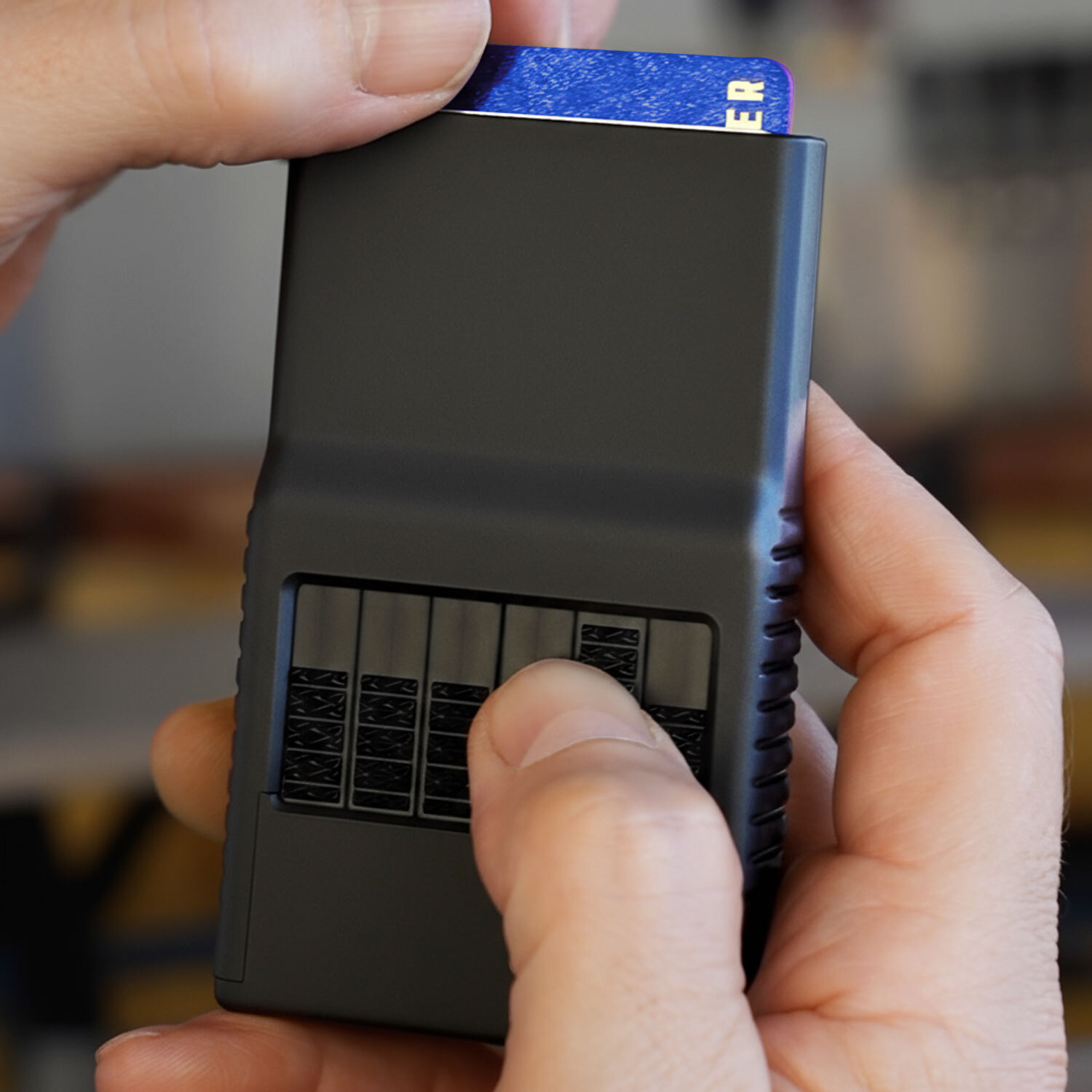 ACM 3.0 Stealth solid aluminum wallet selecting a card