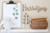 A custom wood nursery name sign