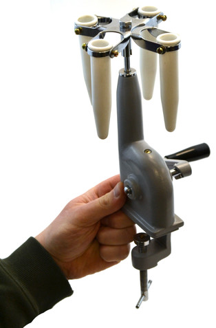 A very economical centrifuge that clamps right to any benchtop. The apparatus has a table clamp, hand crank, and 4 buckets to hold tubes up to 15ml in capacity.