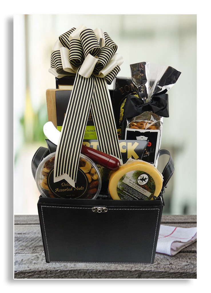 This striking gift trunk for men exudes class and elegance. Includes cheese, crackers, cutting board with cheese knife, assorted nuts, smoked salmon filet, honey mustard pretzels, butter crunch popcorn, tuxedo themed snack mix and chocolate covered toffee almonds. Wine may be added to this gift.