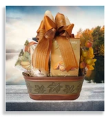 Warm, spiced flavors meet sweet and savory snacks in this seasonal basket, a good fit for hostess gifts, client thank-you gifts, and Thanksgiving gatherings.