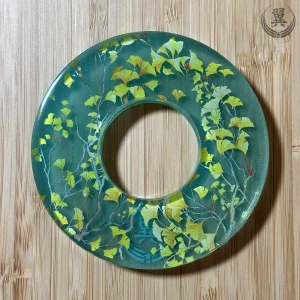 Ichou transparent green handcrafted Tsuba front