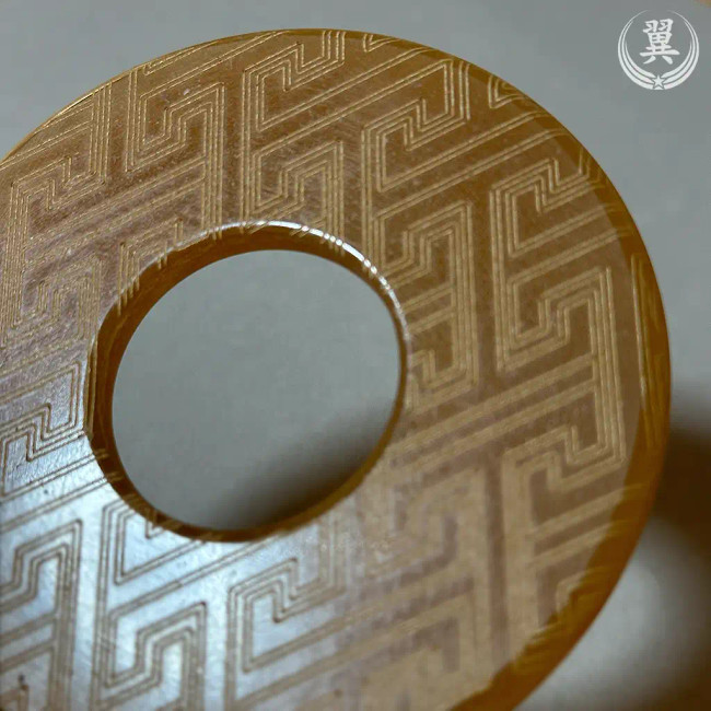 T letter Tsunagi Kawa Tsuba close up
