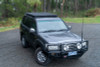 ARB Roof Rack Base with Mount Kit - Flat Rack with Wind Deflector - BASE201 Photo - lifestyle view