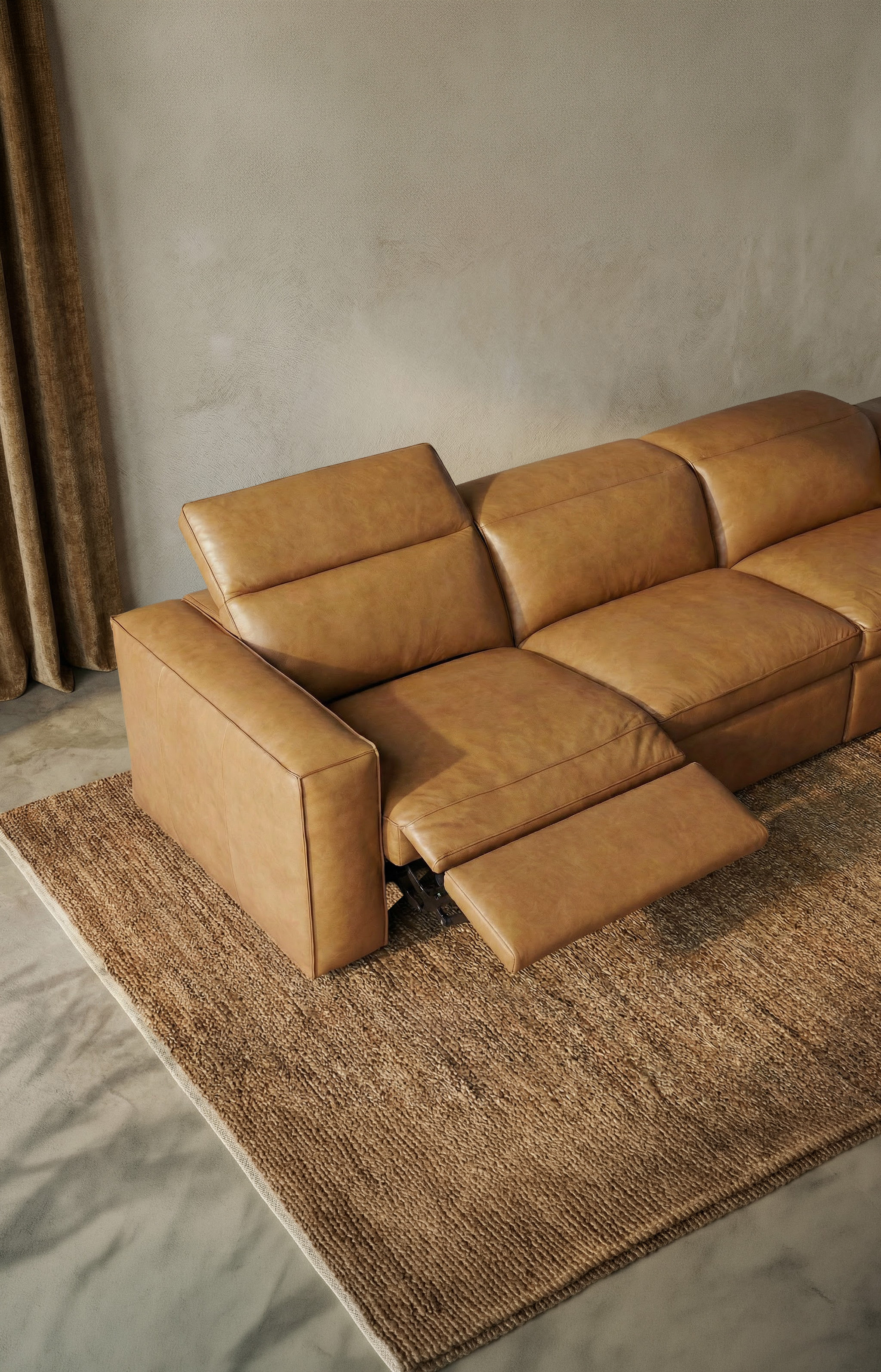 a brown couch with a white wall