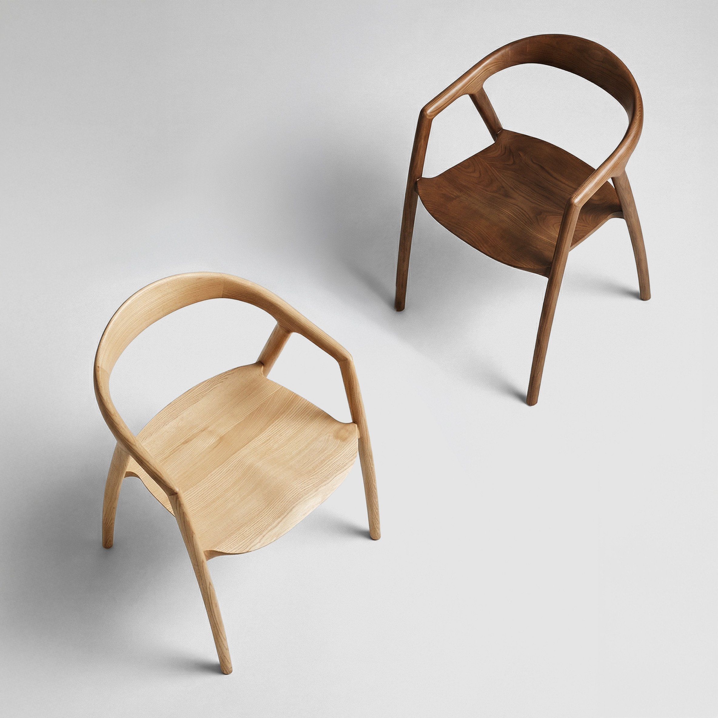 two wooden chairs on a white background