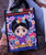 Handmade fabric bag with Frida Kahlo print with closure on the front.