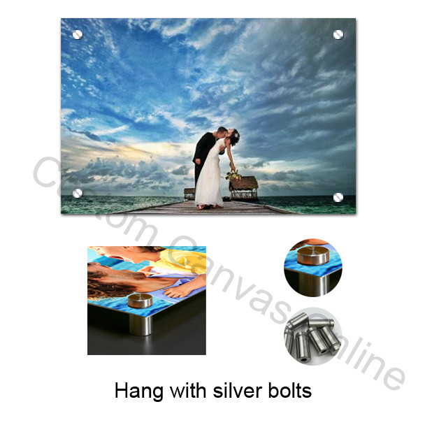 Aluminium photo print with four visible silver bolt fixings and hardware detail