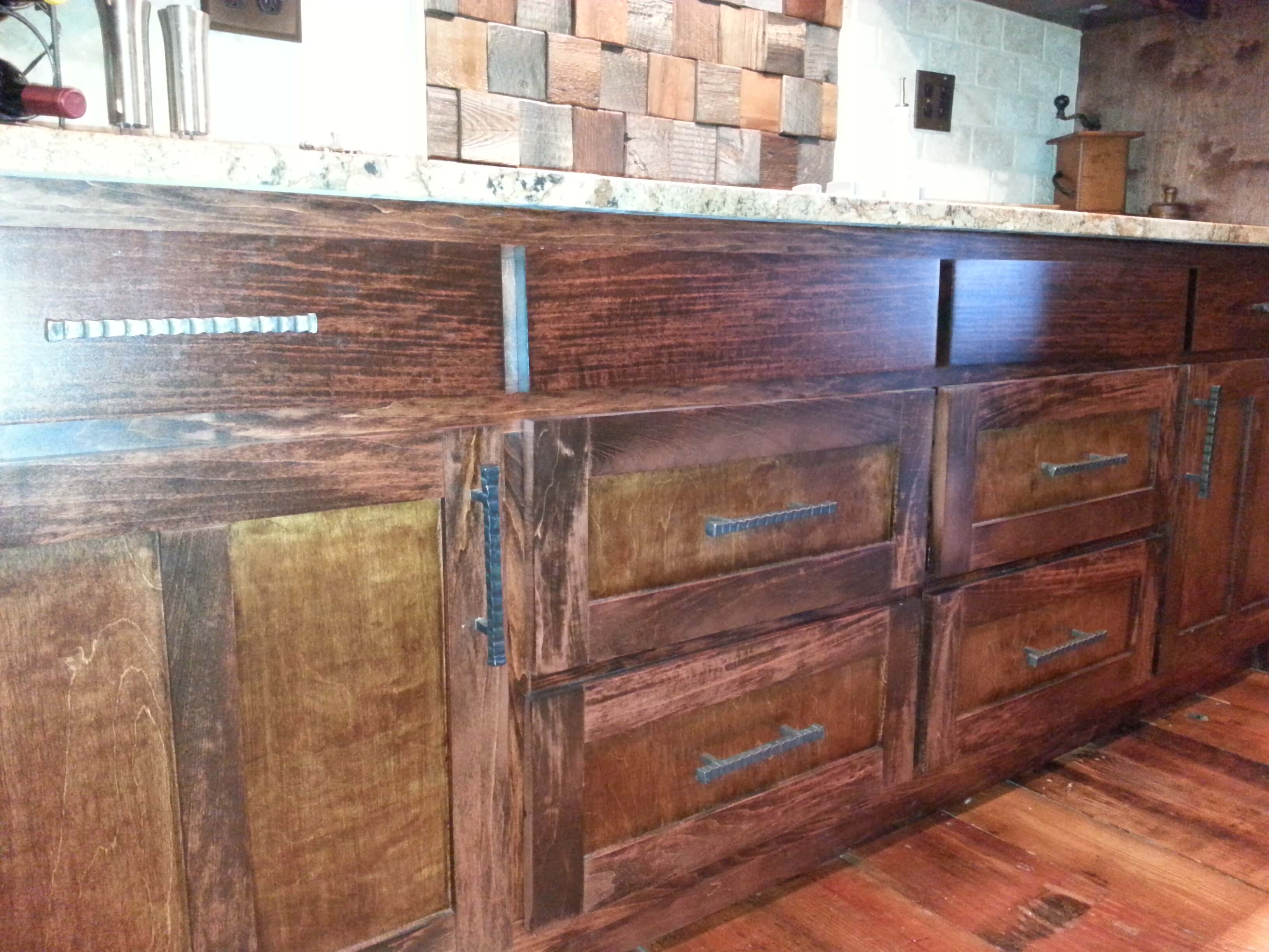 Close-up of cabinets with textured iron pulls