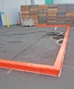 Berm Builder with 6-inch height installed for spill containment.