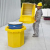 Worker opening the Hard Top P1 Plus Spill Pallet, demonstrating its secure and durable design for hazardous material storage.