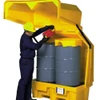 Worker placing drums inside the Hard Top P2, No Drain, showcasing its secure and durable design for spill containment and hazardous material storage.