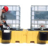 Worker inspecting containers on the Twin IBC Spill Pallet, No Drain, designed for secure and efficient spill containment.