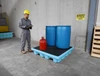 Fluorinated 4-drum spill pallet in a chemical storage area
