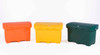 Three colorful utility boxes in orange, yellow, and green with closed lids, displayed side by side on a white background.