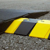 Sidewinder extension in black and yellow, seamlessly connected to a system for cable protection.