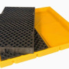 A yellow spill deck with the black grating removed, showing the internal sump design for capturing and containing spills.