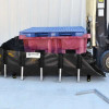 Multiple IBCs placed on an IBC Berm, emphasizing its high-capacity containment and industrial-grade performance.