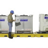 Modular IBC spill pallet system with two tanks, ready for use in an industrial setting for spill protection.