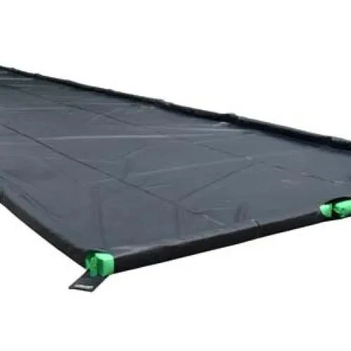 Expanded foam wall spill containment berm showing flexible edges and reinforced corner supports.