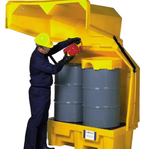 Worker placing drums inside the Hard Top P2, No Drain, showcasing its secure and durable design for spill containment and hazardous material storage.