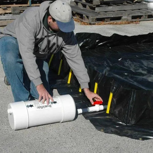 Person installing a self bailer under a container to manage liquid drainage effectively.