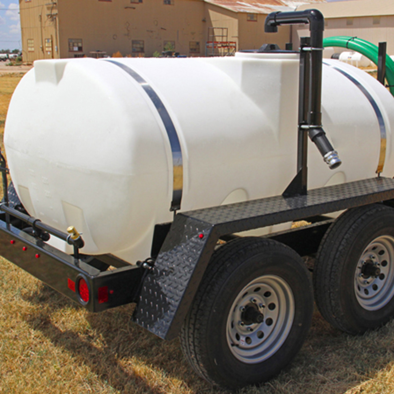 550-gallon water trailer with hose and pump.