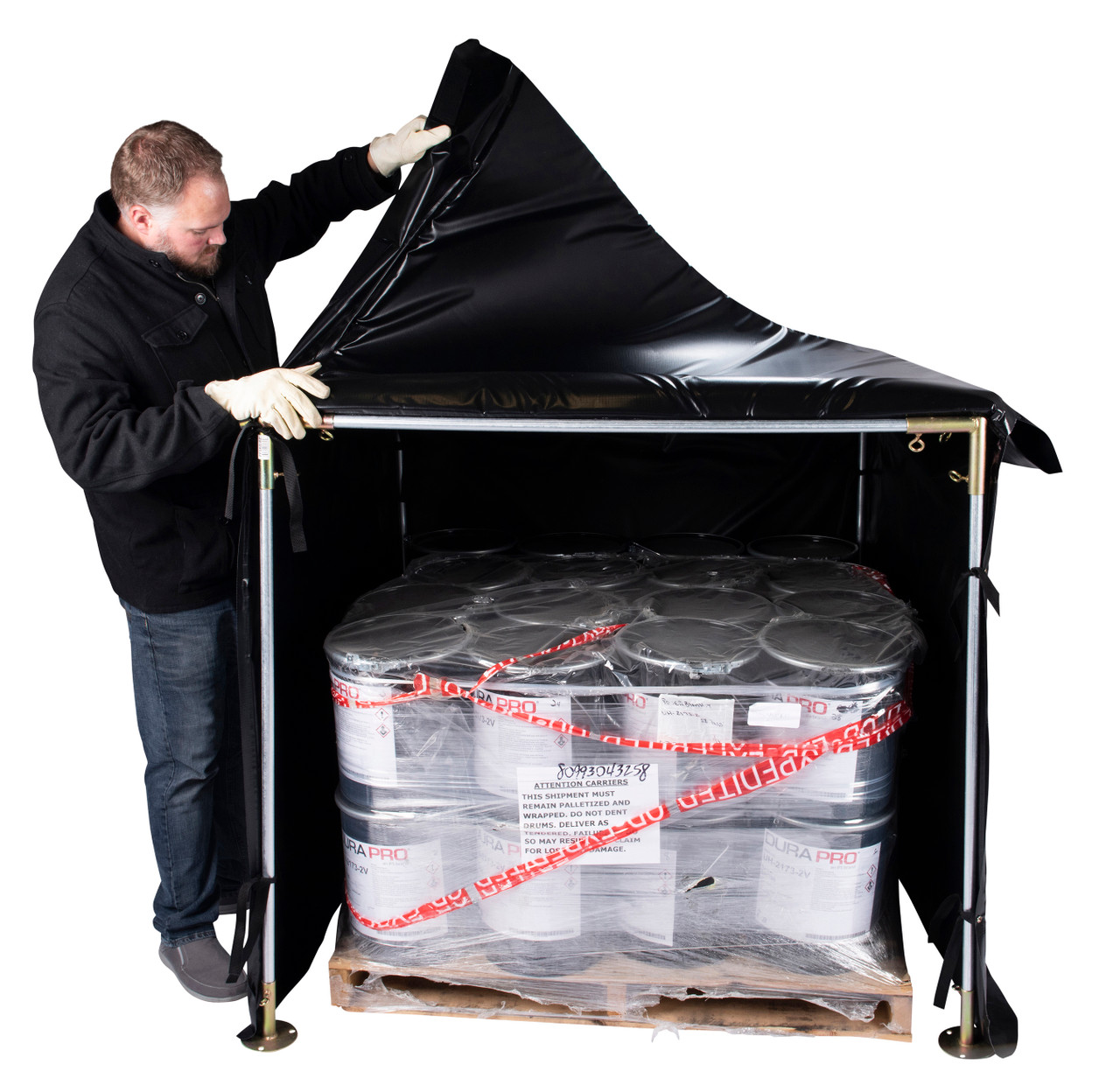 Man opening the Roofer Hot Box heater to reveal a pallet of wrapped industrial containers. Man opening the Roofer Hot Box heater to reveal a pallet of wrapped industrial containers.