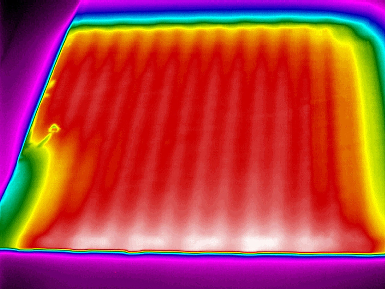 Powerblanket Lite heated pouch temperature distribution visual, demonstrating efficient heating for caulk and sealants.