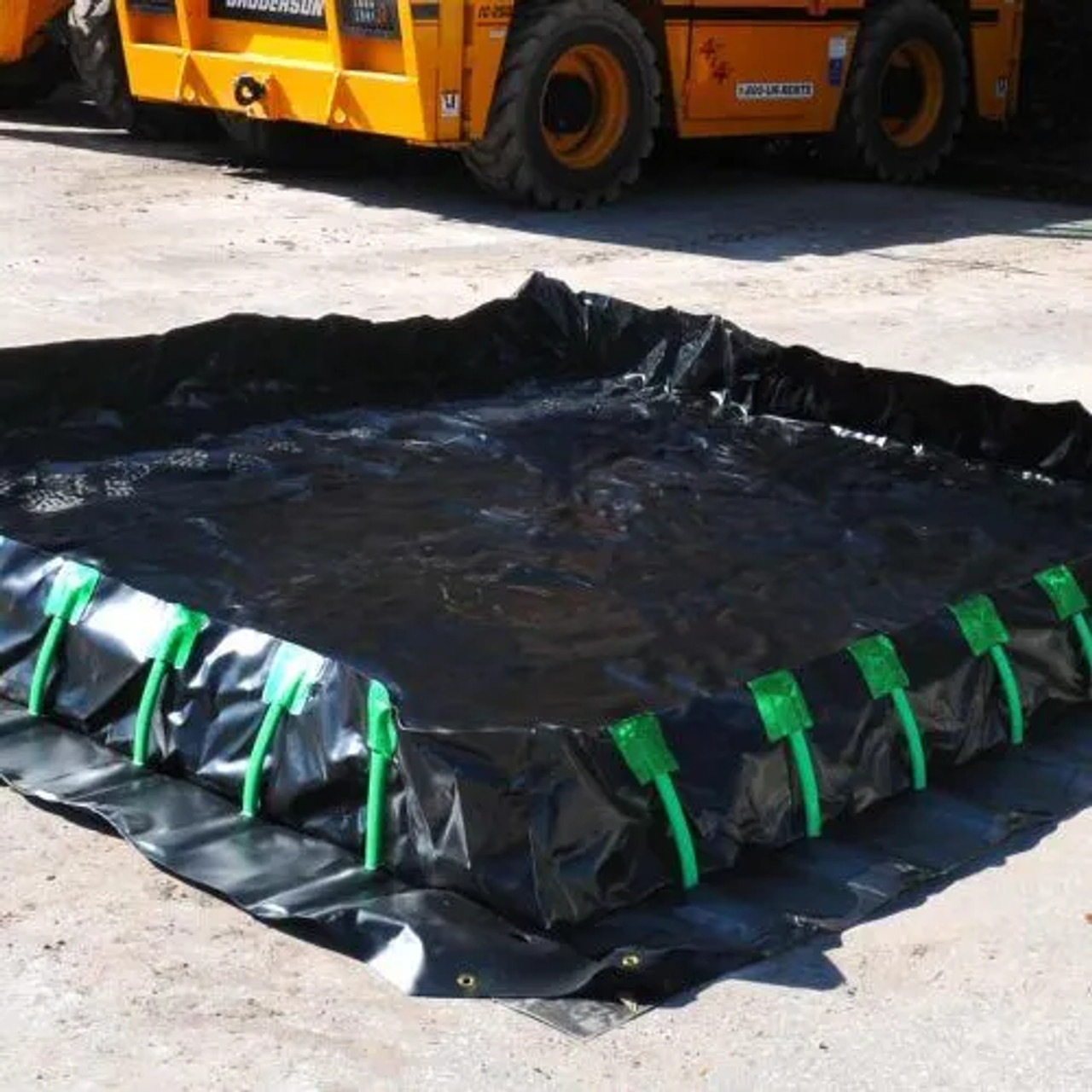 Large industrial spill containment berm for equipment and hazardous liquid storage.