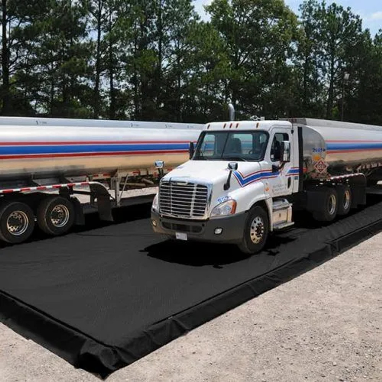 Truck positioned on a modular containment berm, showcasing heavy-duty spill protection and industrial-grade reliability.