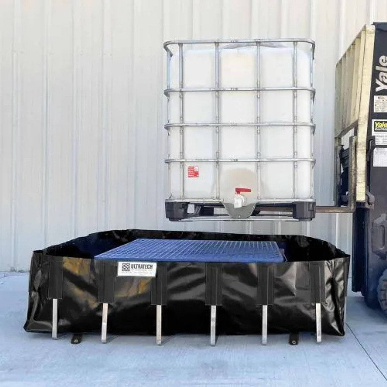 IBC securely placed on an IBC Berm, showcasing its durable and portable design for spill containment in industrial environments.