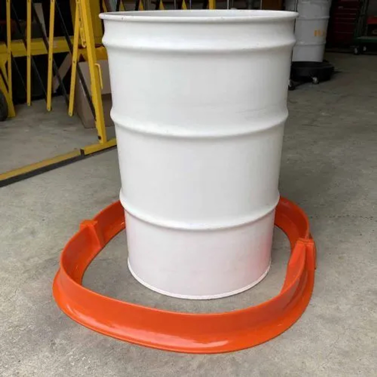 Spill Berm Plus placed around a white drum, effectively containing potential spills in an industrial setting.