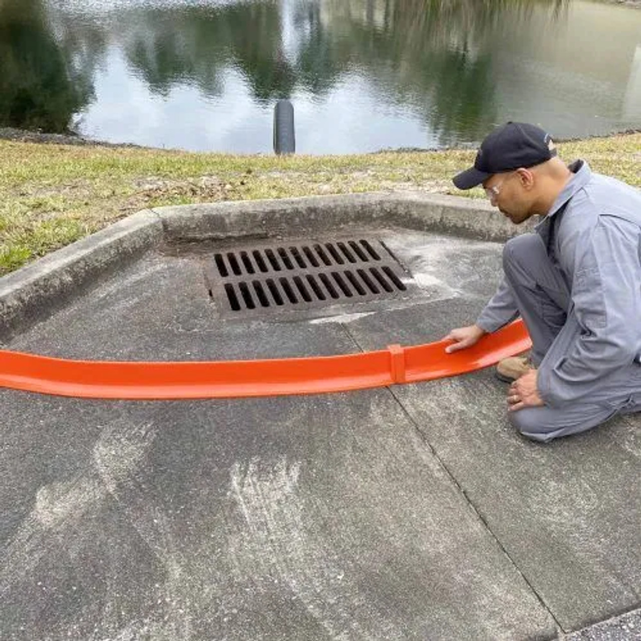 Spill Berm Plus deployed on uneven terrain, effectively adapting to the surface to create a secure barrier.
