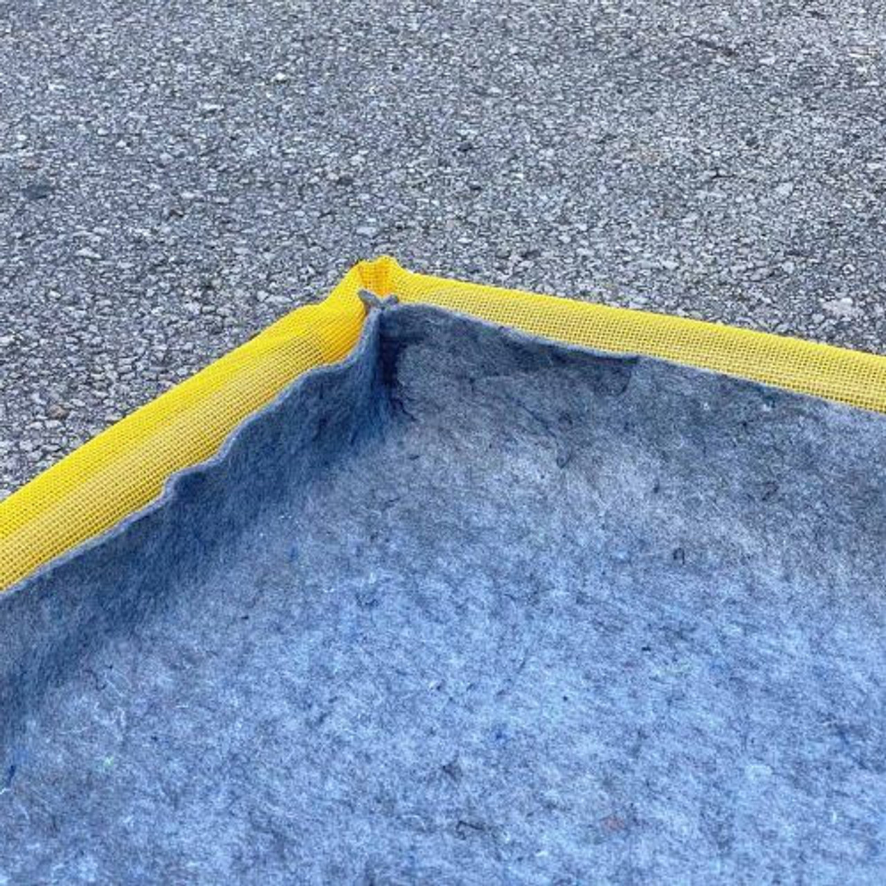 Close-up of a 30 x 24-inch filter pad showcasing its durable and effective material for trapping contaminants and managing spills.