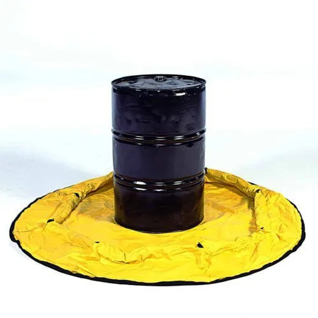 Close-up view of a yellow spill containment berm set up to secure hazardous material containment around machinery.