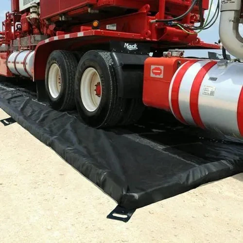Heavy-duty truck stationed on a durable spill containment berm for leak control.