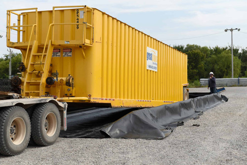Large yellow container positioned within a fully assembled containment wall system. Large yellow container positioned within a fully assembled containment wall system.