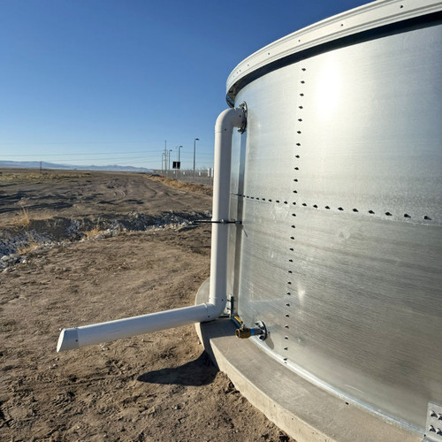 Overflow pipe on the side of a Pioneer flat panel steel water storage tank with ISL dome roof