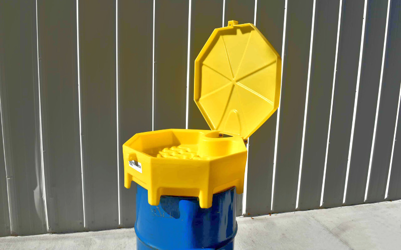 Safety drum funnel with lid for hazardous waste containment. Spill Pallets