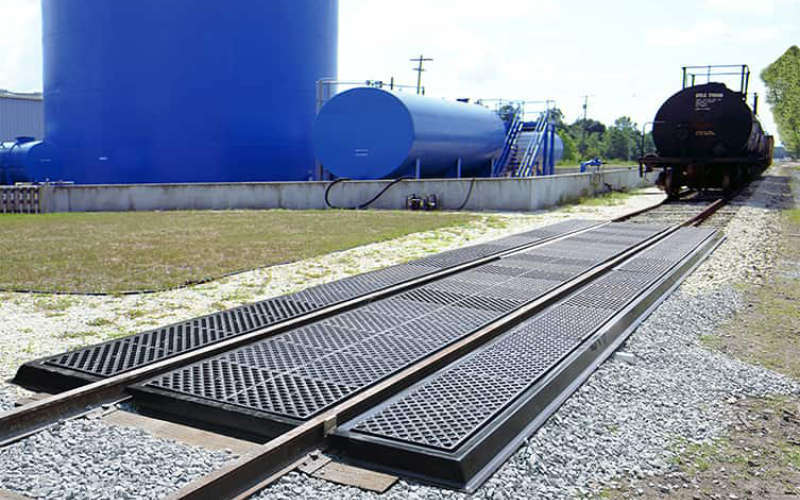 Railroad track pans for spill containment