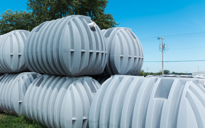 Multiple septic tanks stacked on yard