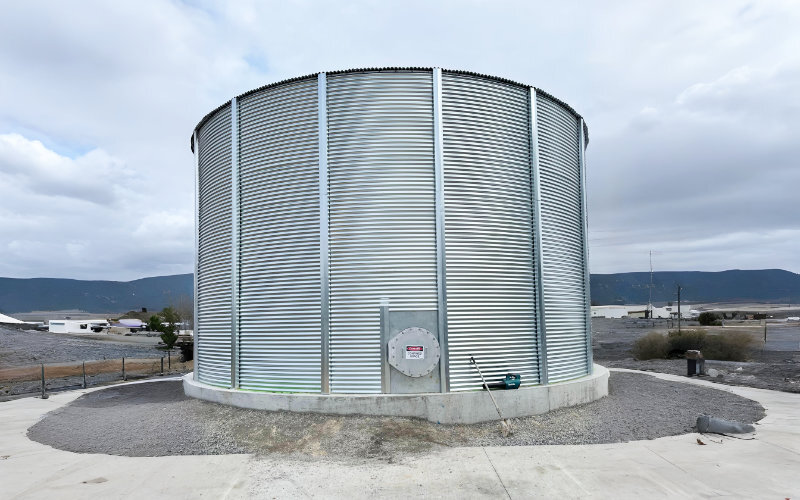 Large corrugated steel water storage tank installation at data center facility