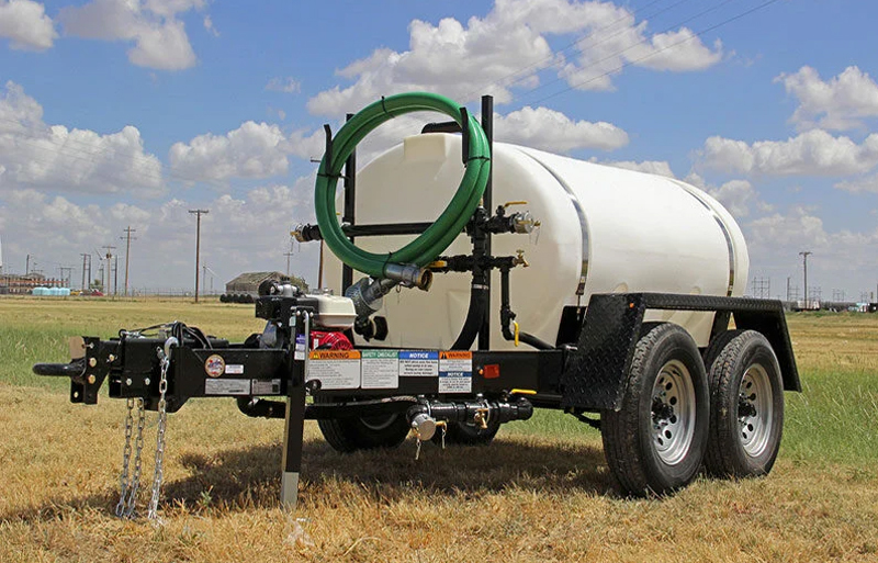 a water buffalo with a white tank on the grass
