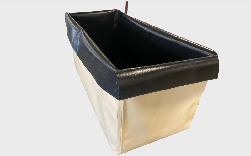 a small rectangular tank with a black cistern liner